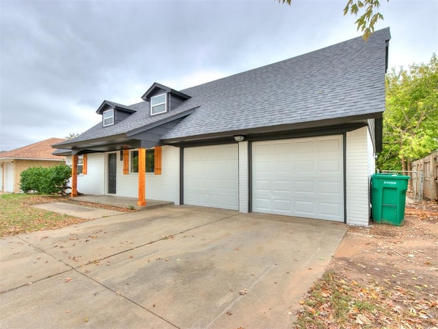 view of front of house with a garage and covered porch