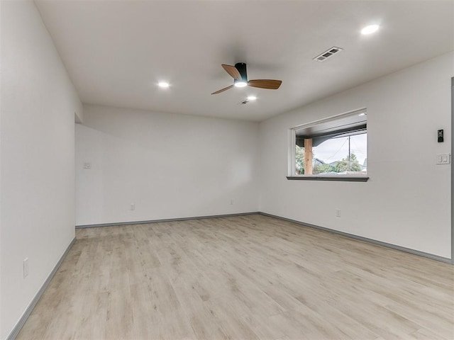 unfurnished room featuring ceiling fan and light hardwood / wood-style flooring