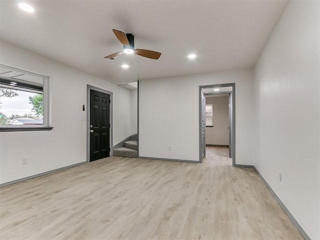 unfurnished room with light hardwood / wood-style flooring and ceiling fan