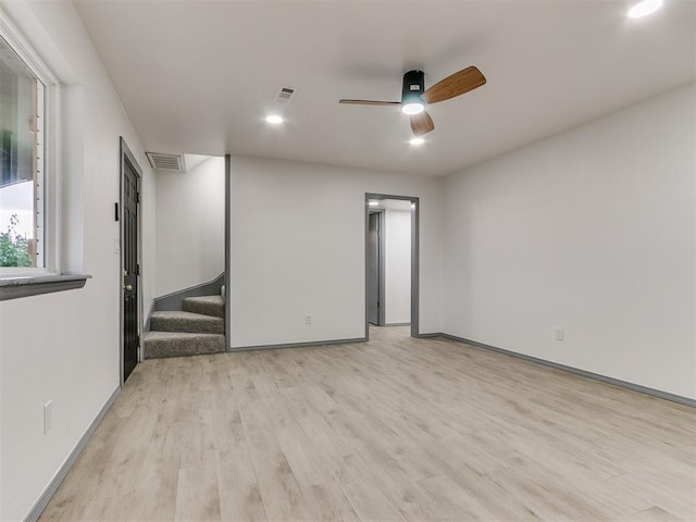 unfurnished room featuring ceiling fan and light hardwood / wood-style floors