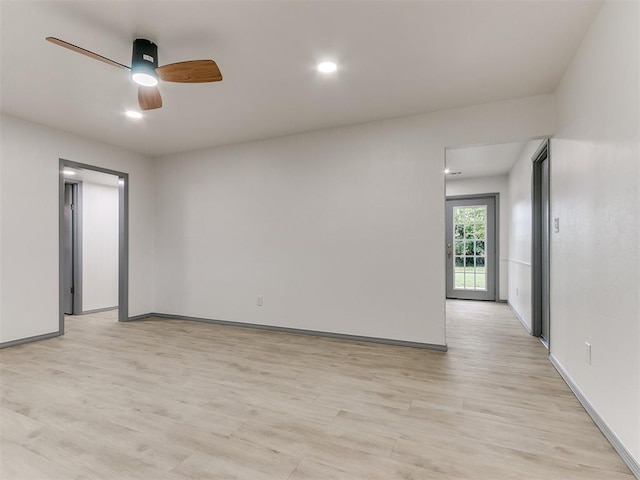 spare room with light hardwood / wood-style flooring and ceiling fan