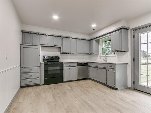 kitchen with gray cabinetry, dishwasher, and black range with electric cooktop