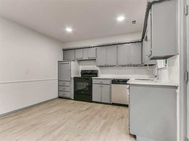 kitchen with stainless steel dishwasher, black electric range oven, gray cabinets, and sink