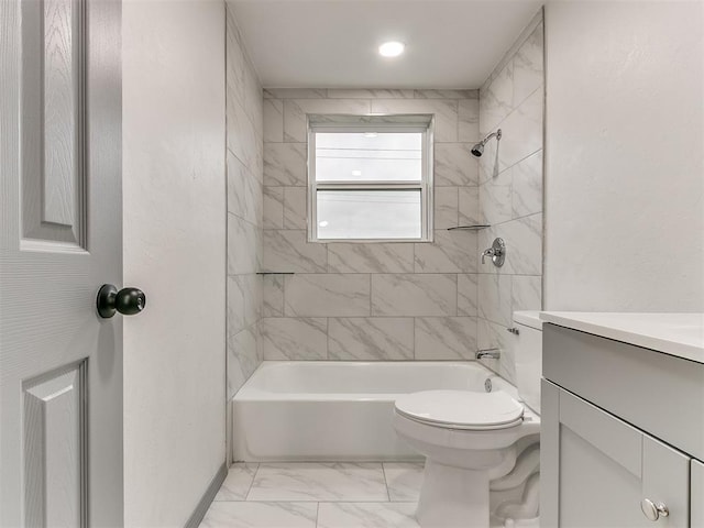 full bathroom with toilet, vanity, and tiled shower / bath combo