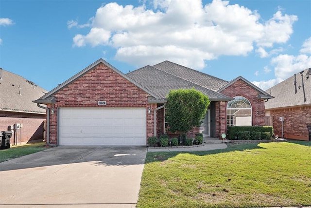 view of front property featuring a front lawn and a garage