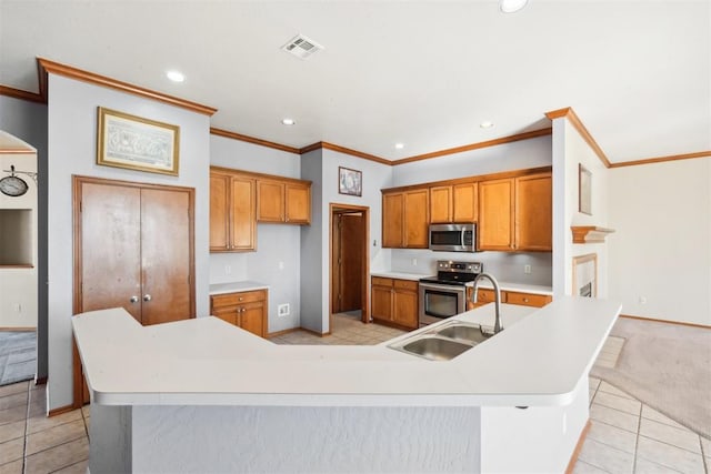 kitchen featuring sink, a spacious island, light tile patterned floors, and stainless steel appliances