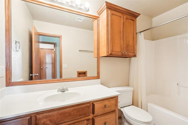 full bathroom featuring shower / bath combo, vanity, and toilet