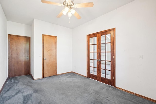 carpeted spare room featuring ceiling fan and french doors