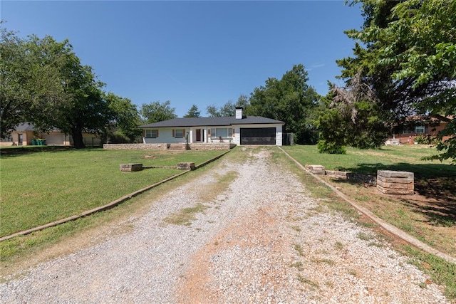 ranch-style house with a front yard and a garage