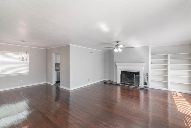 unfurnished living room with ceiling fan, dark hardwood / wood-style floors, and ornamental molding