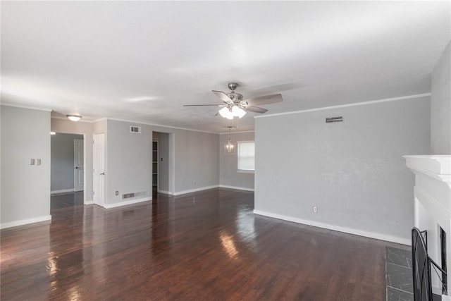 unfurnished living room with dark hardwood / wood-style floors, ceiling fan, and crown molding