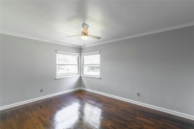 empty room featuring dark hardwood / wood-style floors, ceiling fan, ornamental molding, and a textured ceiling