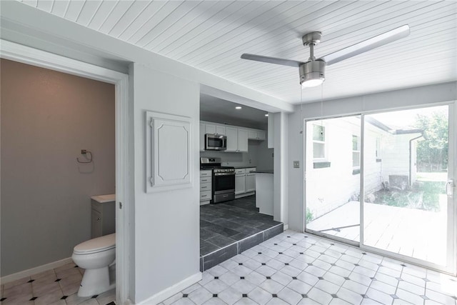 interior space with ceiling fan