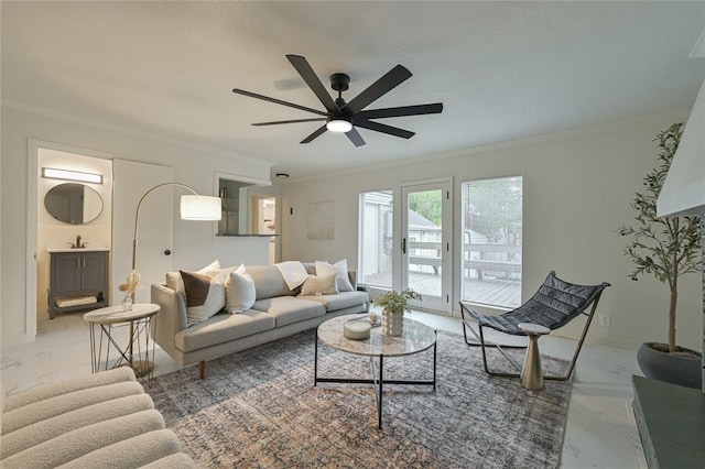 living room with ceiling fan, sink, and crown molding