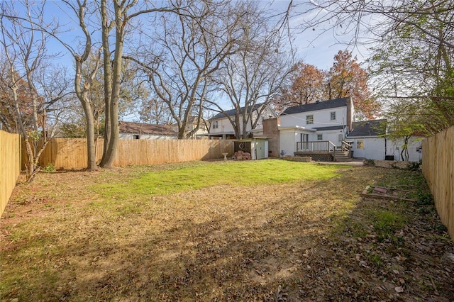 view of yard with a wooden deck