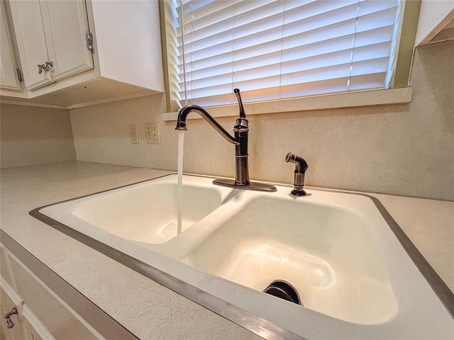 room details with sink and white cabinets