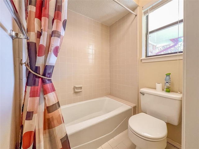 bathroom with tile patterned floors, a textured ceiling, toilet, and shower / bath combo with shower curtain