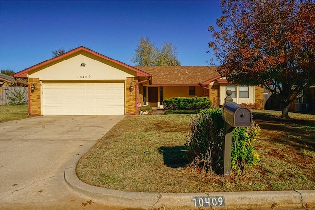 ranch-style home featuring a garage and a front lawn