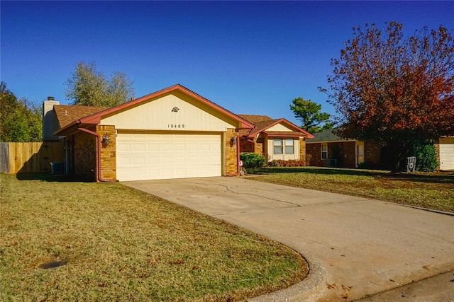 ranch-style home with a front yard and a garage