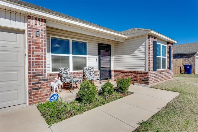 view of exterior entry featuring a garage