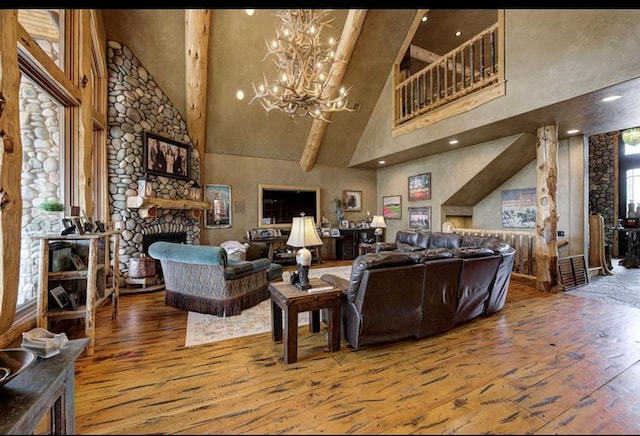 living room featuring a fireplace, high vaulted ceiling, beamed ceiling, and hardwood / wood-style flooring