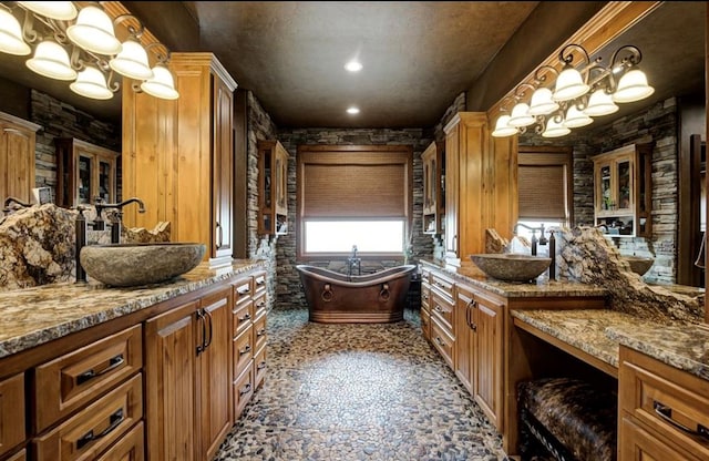 bathroom featuring a tub and vanity