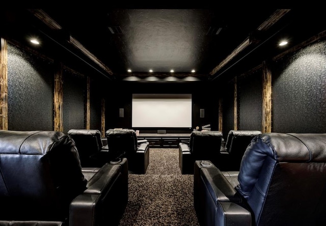 carpeted home theater with crown molding