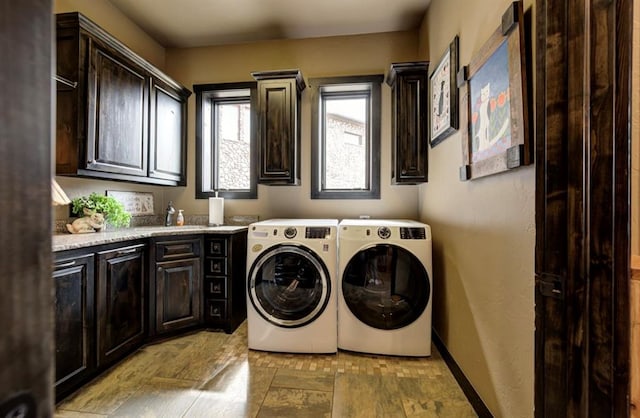 laundry area featuring cabinets and washing machine and clothes dryer