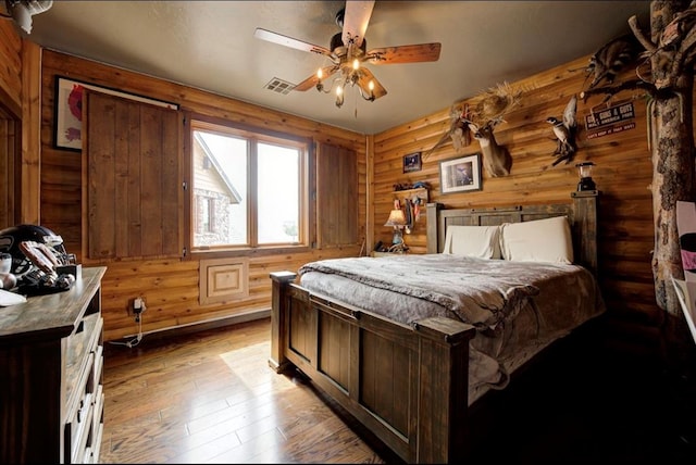 bedroom with light hardwood / wood-style flooring and ceiling fan