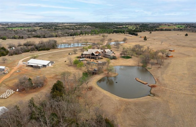 aerial view with a rural view and a water view