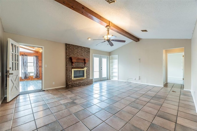 unfurnished living room with french doors, light tile patterned flooring, vaulted ceiling with beams, a textured ceiling, and a fireplace