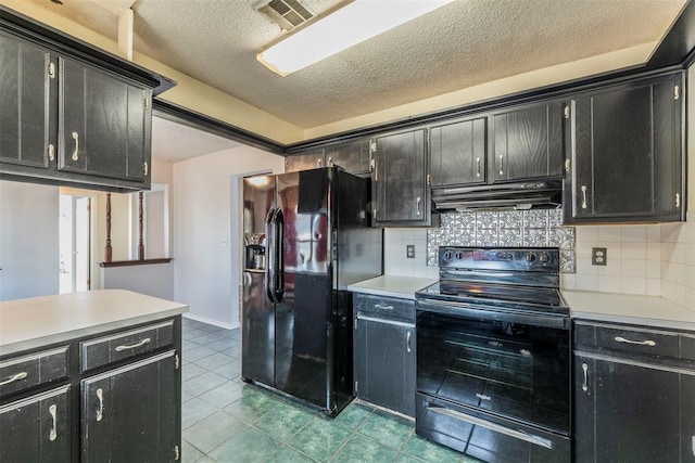 kitchen featuring tasteful backsplash, light tile patterned floors, a textured ceiling, and black appliances