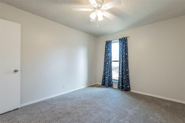 carpeted spare room with ceiling fan and a textured ceiling