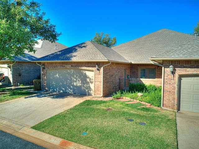 ranch-style home featuring a front yard and a garage