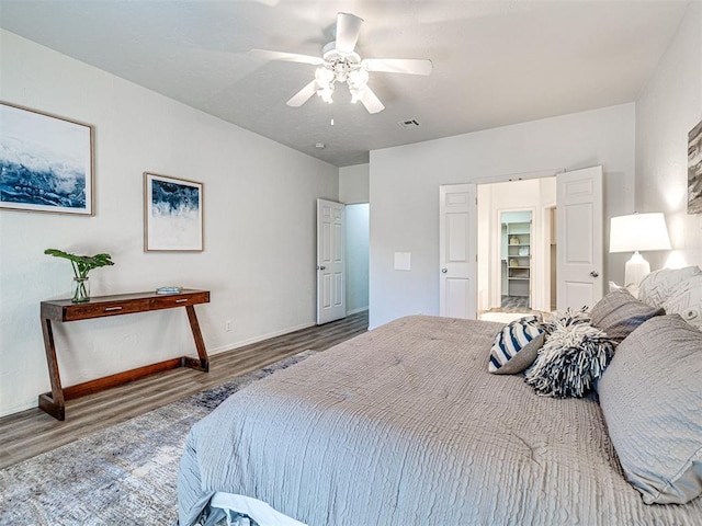 bedroom featuring ceiling fan and wood-type flooring