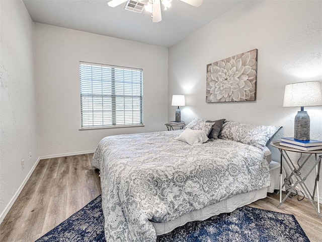 bedroom featuring hardwood / wood-style flooring and ceiling fan