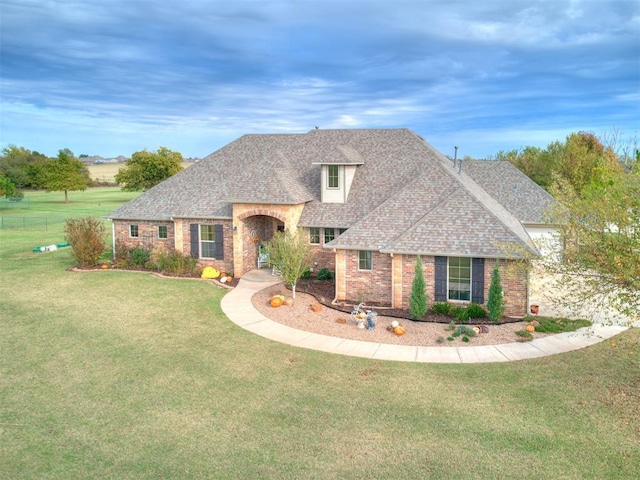 view of front of home with a front lawn