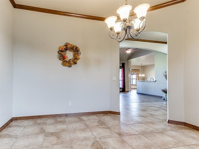 tiled spare room featuring crown molding and a chandelier