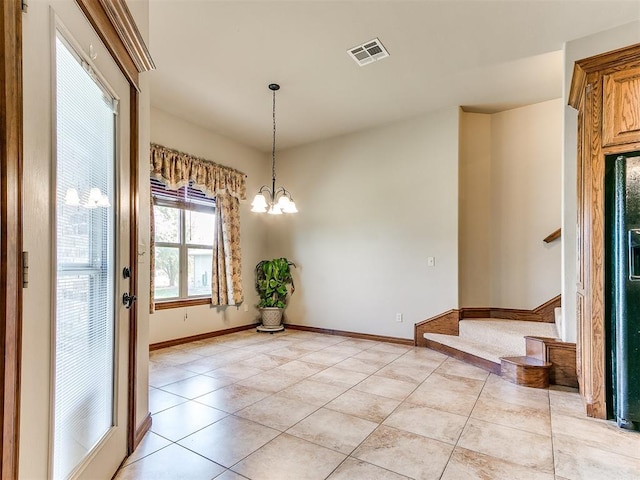 interior space featuring light tile patterned floors and a notable chandelier