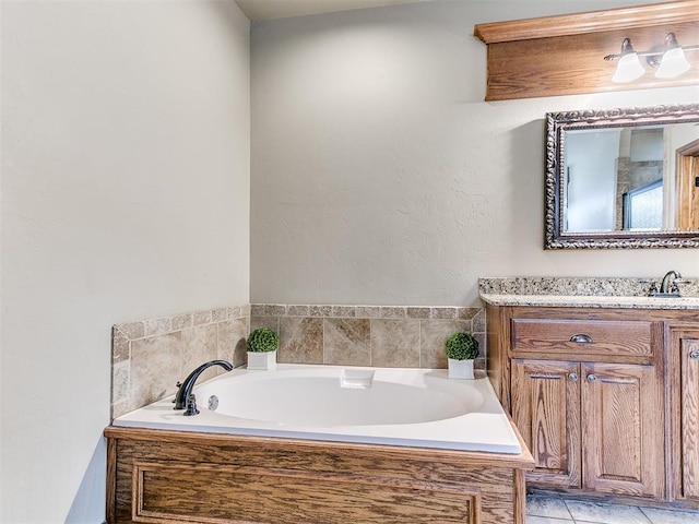 bathroom featuring vanity and a relaxing tiled tub