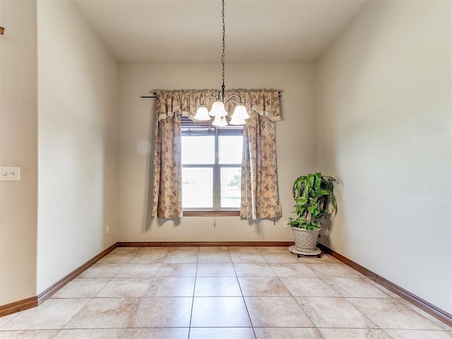 unfurnished dining area with an inviting chandelier and light tile patterned flooring