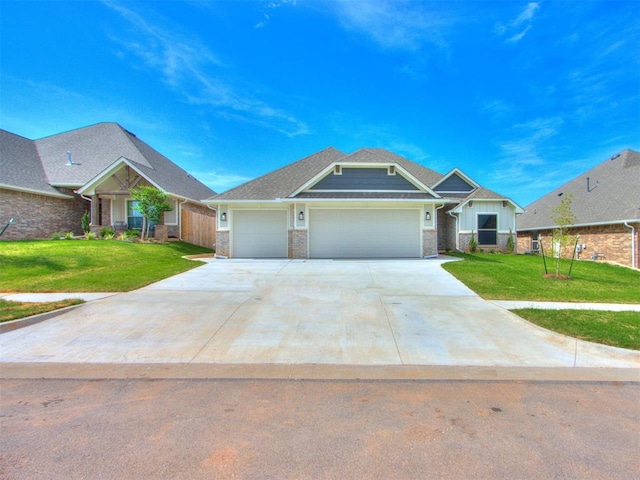 craftsman-style house with a garage and a front lawn