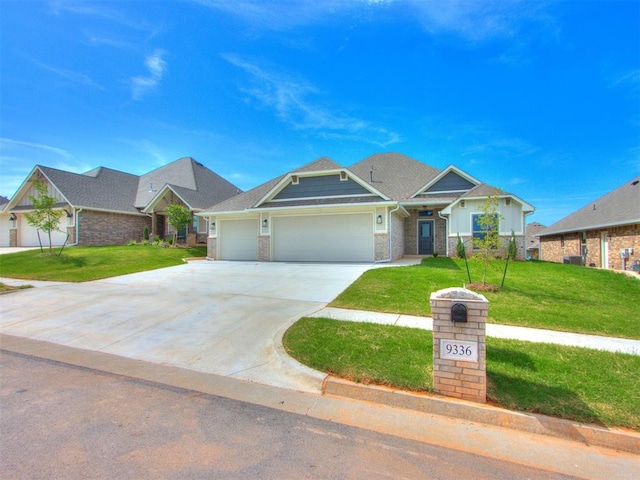 craftsman-style home with a garage and a front yard