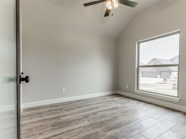 interior space featuring ceiling fan, light hardwood / wood-style floors, and vaulted ceiling