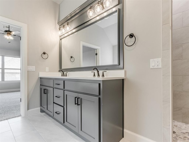 bathroom featuring ceiling fan, tile patterned flooring, vanity, and tiled shower