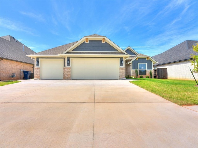 view of front of home featuring a garage and a front yard