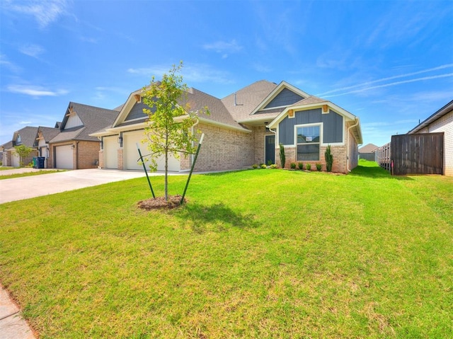 view of front of property with a front yard and a garage