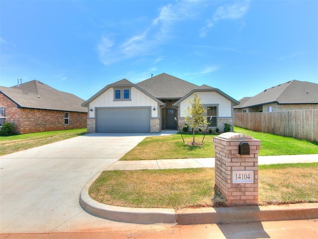 view of front facade with a garage and a front yard