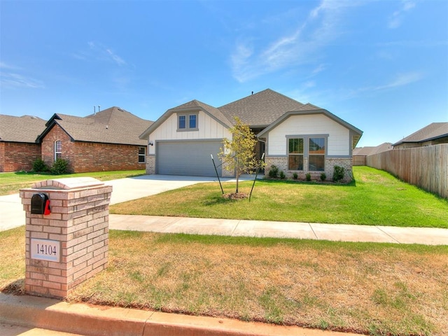 view of front of home with a front lawn and a garage