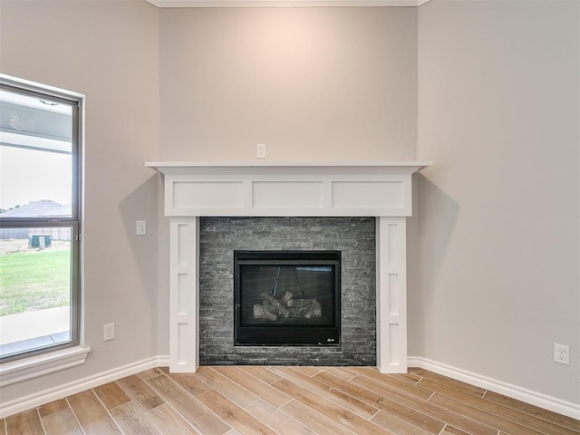 details with a fireplace and hardwood / wood-style floors